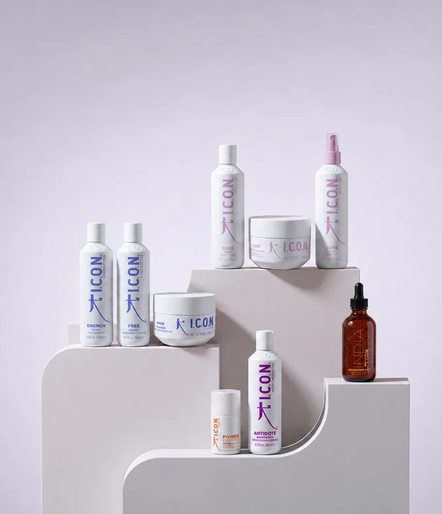 Nine I.C.O.N. products from the Hydration, Cure, Antidote, Power and India lines arranged on white pedestals
