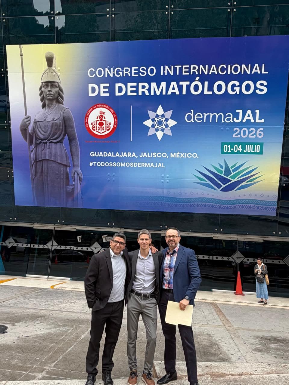 Ingmar Claes with two colleagues in front of the dermaJAL 2026 congress sign in Guadalajara